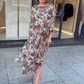 Rochie fluidă cu imprimeu floral și guler rotund